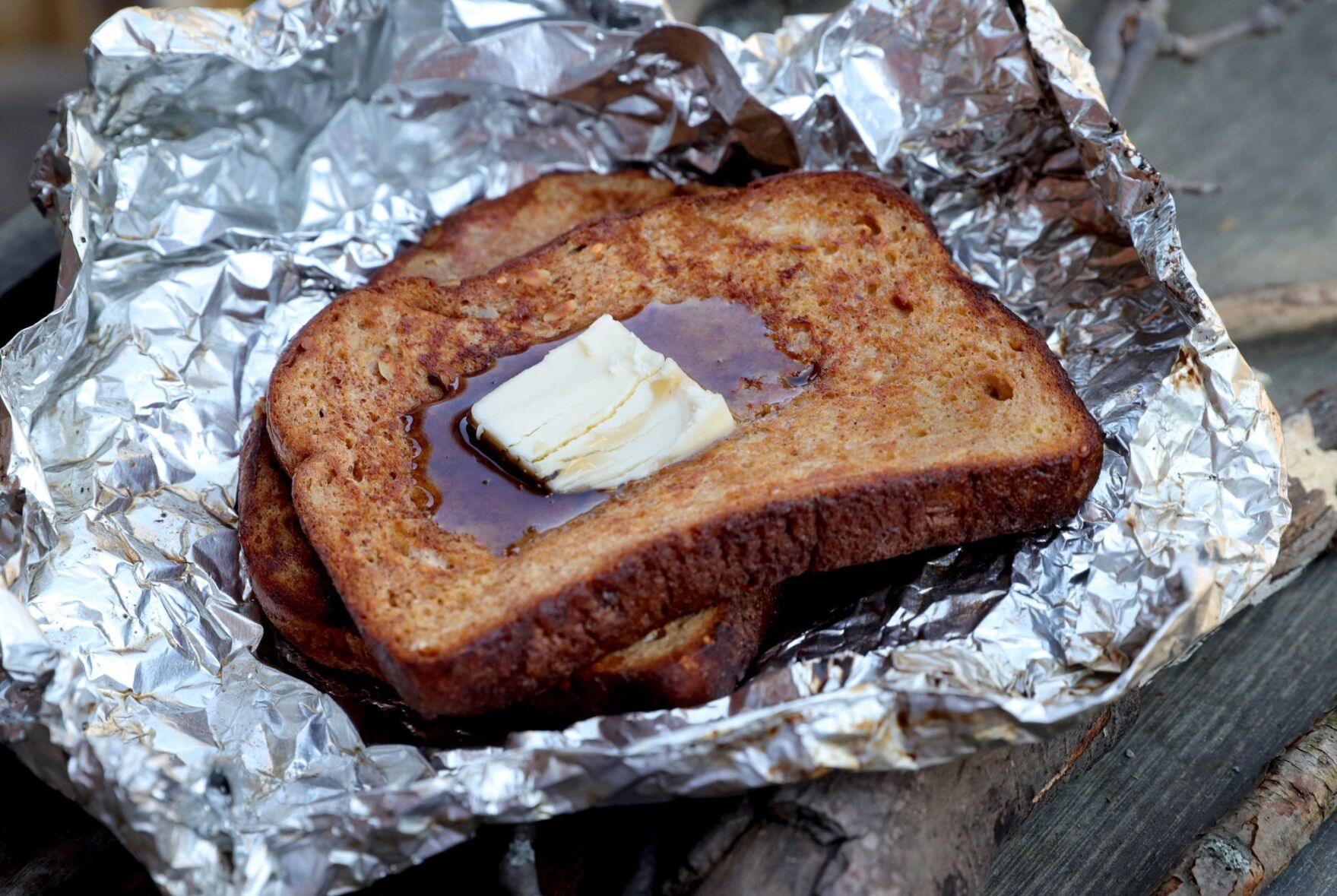 The flames add flavor in campfire cooking